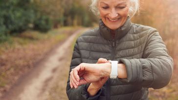 woman, senior, seniors, exercise, exercising, lockdown, covid-19, run, running, jog, jogging, smart watch, fitness tracker, app, smart technology, health, healthy lifestyle, outdoors, countryside, retired, retirement, elderly, front view, waist up, women, female, one person, person, people, 60s, sixties, caucasian, smiling, positive, lockdown, active, fitness, autumn, fall